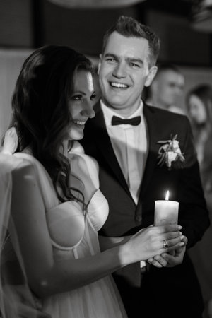 ceremony of passing the wedding fire from parents to children with lighting candlesの写真素材