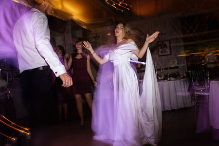 the first dance of the bride and groom inside a restaurant with heavy smokeの写真素材