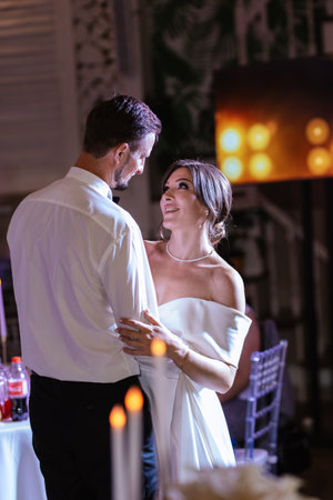 the first dance of the bride and groom inside a restaurant with heavy smokeの写真素材