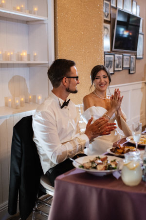 portrait of the newlyweds at the presidium at the wedding banquetの写真素材