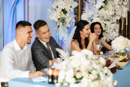 portrait of the newlyweds at the presidium at the wedding banquetの写真素材