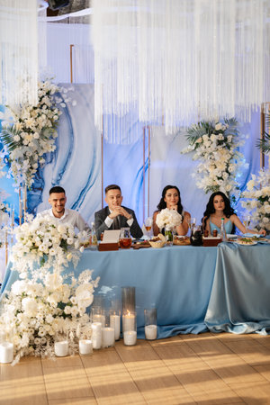 portrait of the newlyweds at the presidium at the wedding banquetの写真素材