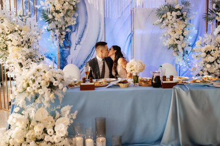 portrait of the newlyweds at the presidium at the wedding banquetの写真素材