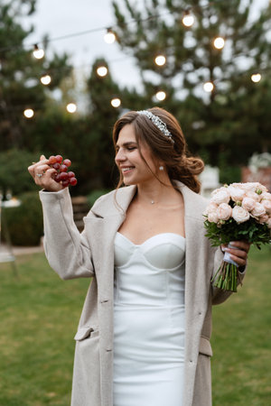 cheerful young bride at a banquet in a country cottageの写真素材