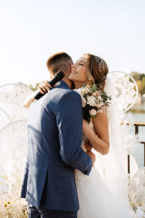 wedding ceremony of the newlyweds on the pier near the restaurantの写真素材