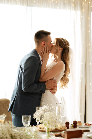portrait of the newlyweds at the presidium at the wedding banquetの写真素材