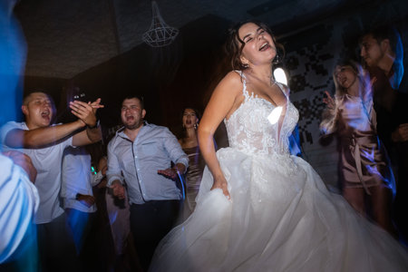 the first dance of the bride and groom inside a restaurant with heavy smoke