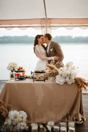 portrait of the newlyweds at the presidium at the wedding banquetの写真素材