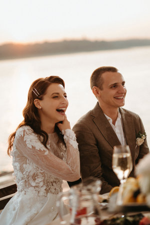 portrait of the newlyweds at the presidium at the wedding banquetの写真素材