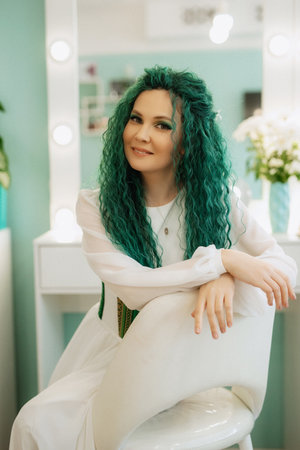 portrait of a bride with green curly hair in the morning in the beauty roomの写真素材