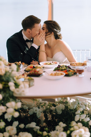 portrait of the newlyweds at the presidium at the wedding banquetの写真素材