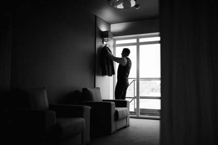 portrait of groom in blue three piece suit with tie on wedding dayの写真素材