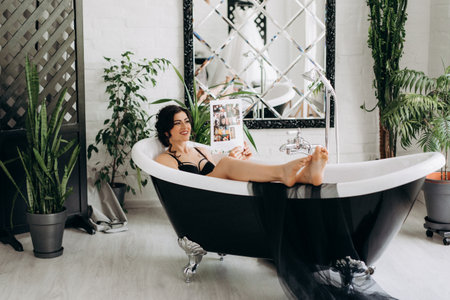 black-haired bride girl getting ready for groom in boudoir with bath