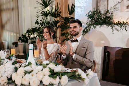 portrait of the newlyweds at the presidium at the wedding banquetの写真素材