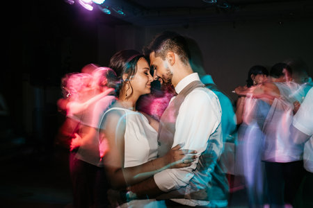 the first dance of the bride and groom inside a restaurantの写真素材