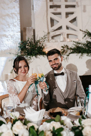 portrait of the newlyweds at the presidium at the wedding banquetの写真素材