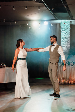 the first dance of the bride and groom inside a restaurantの写真素材