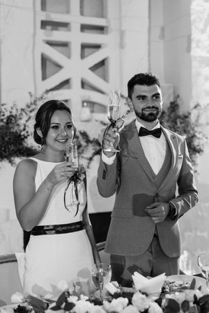 portrait of the newlyweds at the presidium at the wedding banquetの写真素材