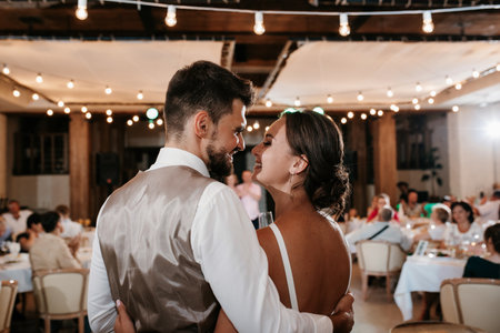 the first dance of the bride and groom inside a restaurantの写真素材