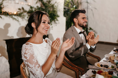 portrait of the newlyweds at the presidium at the wedding banquetの写真素材