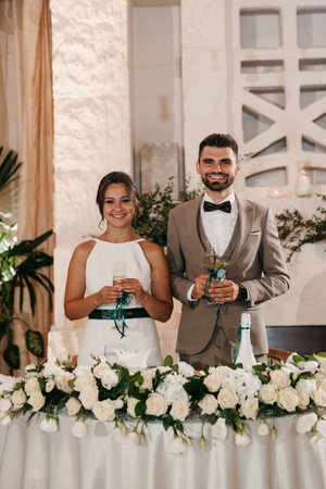 portrait of the newlyweds at the presidium at the wedding banquetの写真素材
