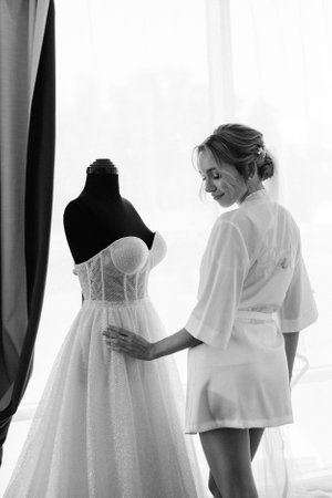 black-haired bride girl getting ready for groomの写真素材
