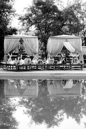 young girls relaxing on sun loungers near the pool