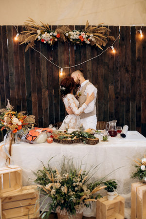 portrait of the newlyweds at the presidium at the wedding banquetの写真素材