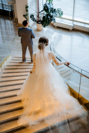 first meeting of the bride and groom on the hotel stairsの写真素材