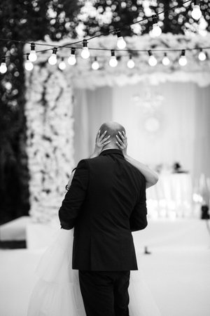 The first dance of the bride and groom in an open-air restaurantの写真素材