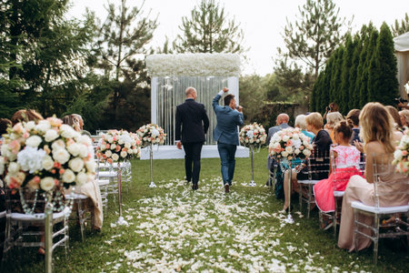 The newlyweds outdoor wedding ceremony in an open-air near the restaurantの写真素材