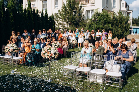 The newlyweds outdoor wedding ceremony in an open-air near the restaurantの写真素材