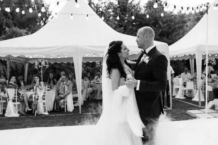 The first dance of the bride and groom in an open-air restaurantの写真素材