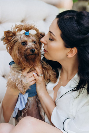 black-haired bride prepares for her wedding in a boudoir in the gardenの写真素材