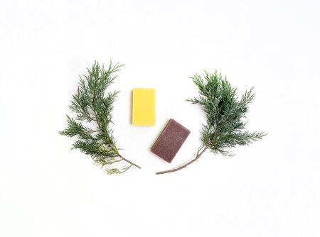 composition of lotion soap and juniper on a white background top view.の写真素材