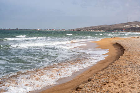 The storm and the waves of the sea. Sandy beach. Vacation, vacation, privacy
