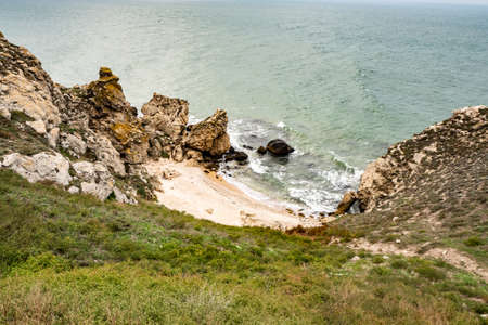 Mountains of steel and stones on the seashore. Wild beach. holidays, privacy,の写真素材