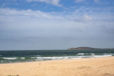 The storm and the waves of the sea. Sandy beach. Vacation, vacation, privacy