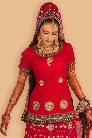 Slim beautiful woman wearing luxurious wedding dress over white studio backgroundの写真素材