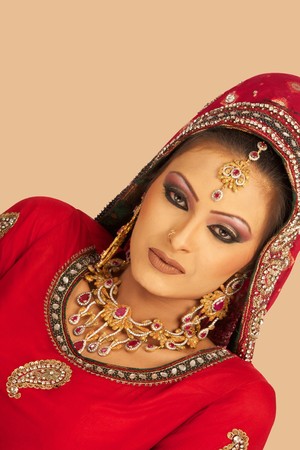 Slim beautiful woman wearing luxurious wedding dress over white studio backgroundの写真素材