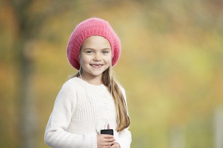 Young Girl Outdoors With MP3 Player