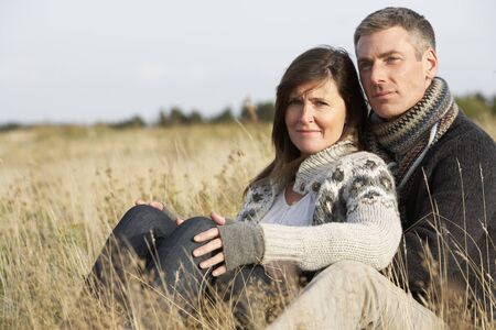 Romantic Young Couple In Autumn Landscapeの写真素材