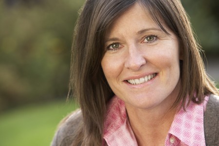 Close Up Portrait Of Smiling Brunette Woman Outdoorsの写真素材