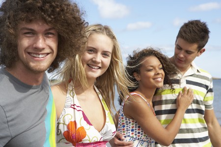 Group Of Young Friends Having Fun On Summer Beach Togetherの写真素材