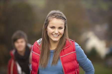 Teenage Girl Outside With Boyfriend In Backgroundの写真素材