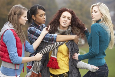 Group Of Female Teenagers Bullying Girlの写真素材