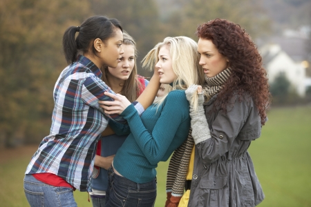 Group Of Female Teenagers Bullying Girlの写真素材