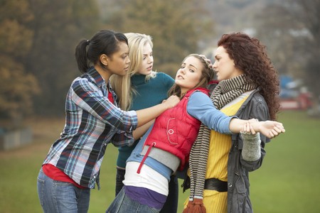 Group Of Female Teenagers Bullying Girlの写真素材