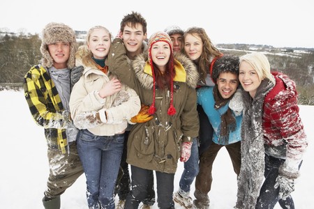 Group Of Teenage Friends Having Fun In Snowy Landscapeの写真素材