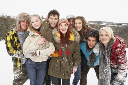 Group Of Teenage Friends Having Fun In Snowy Landscapeの写真素材